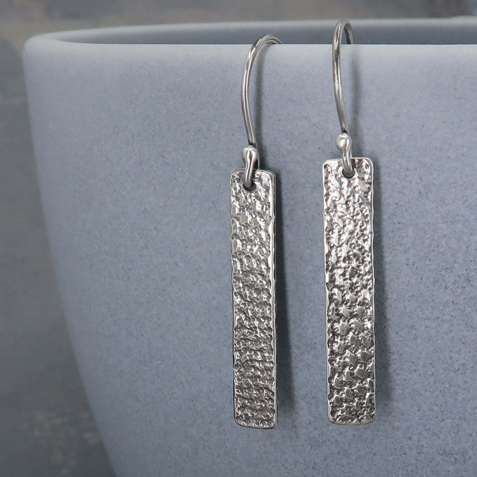 Rectangle sterling silver earrings with an organic industrial texture