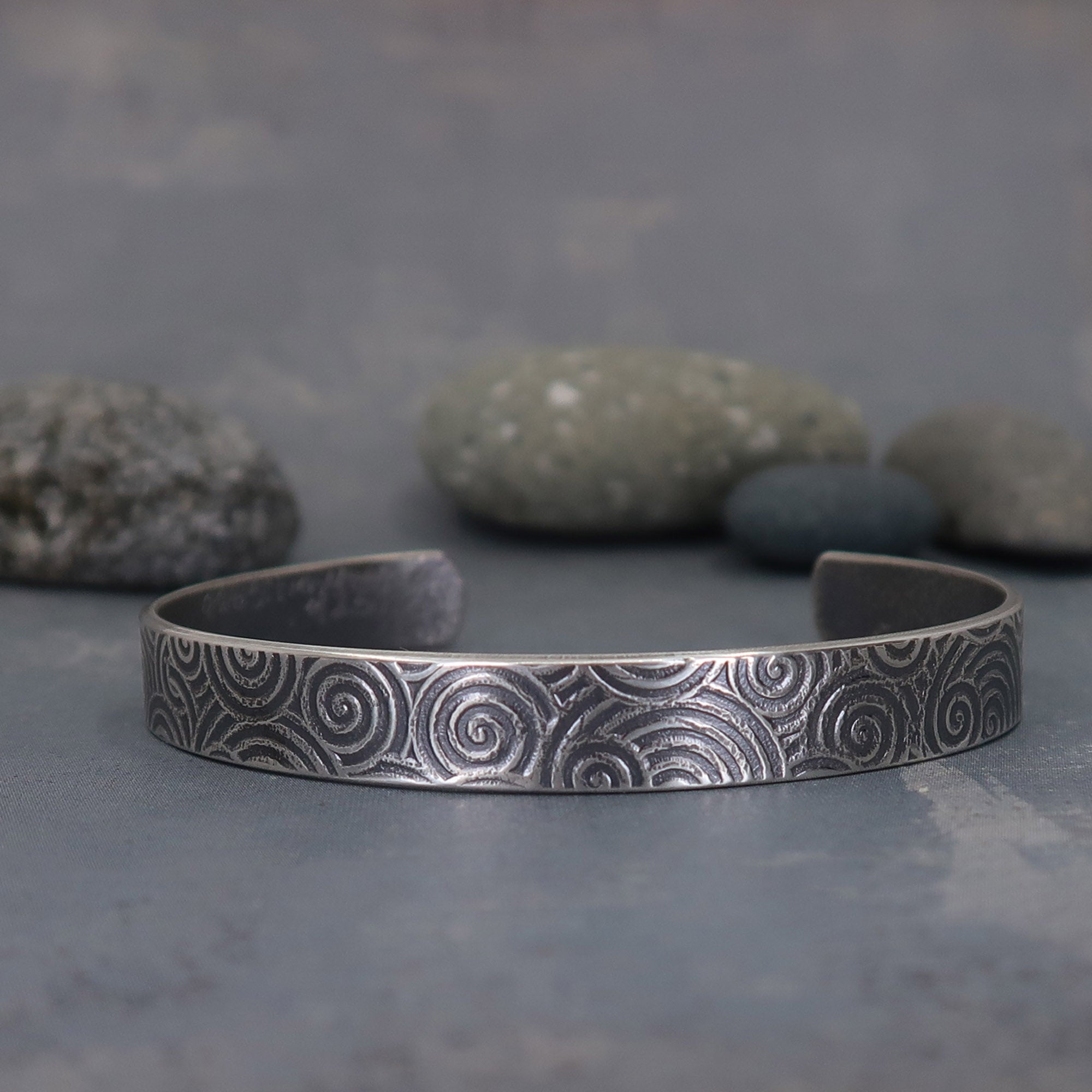 Sterling silver cuff bracelet with spiral pattern