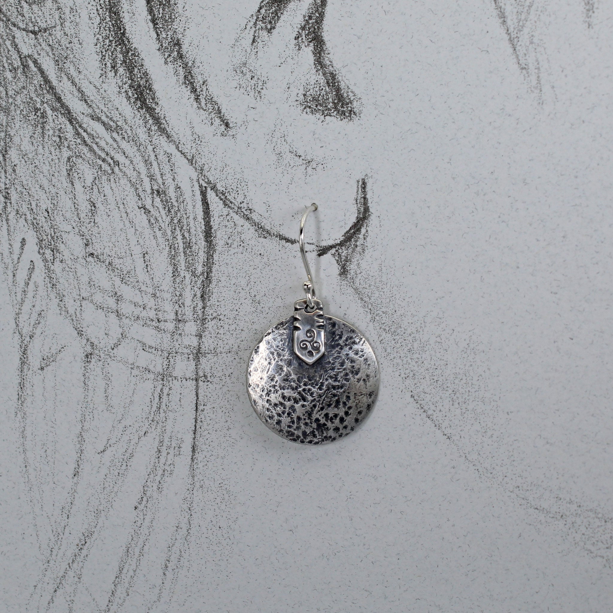 Earrings shown on life size drawing