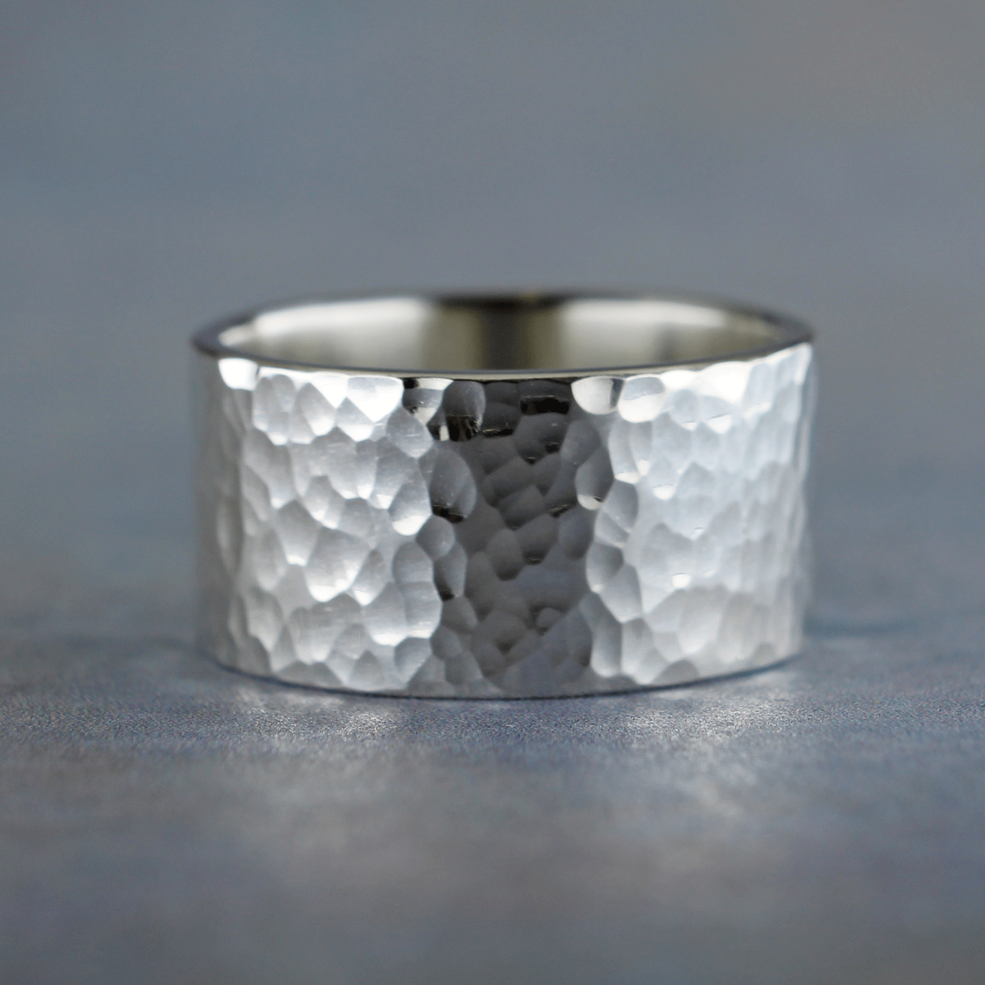 Wide hammered silver ring with personalized inscription