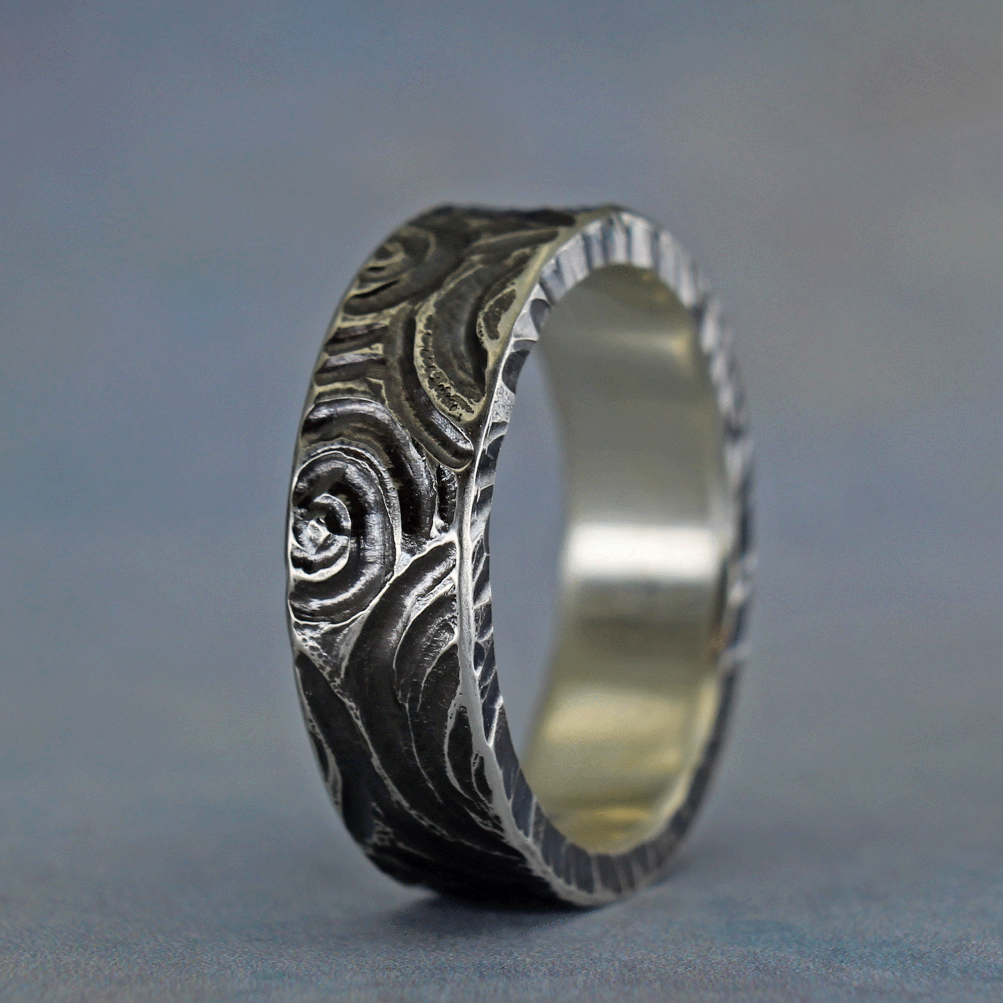 Hand carve sterling silver ring inspired by newgrange rock carvings
