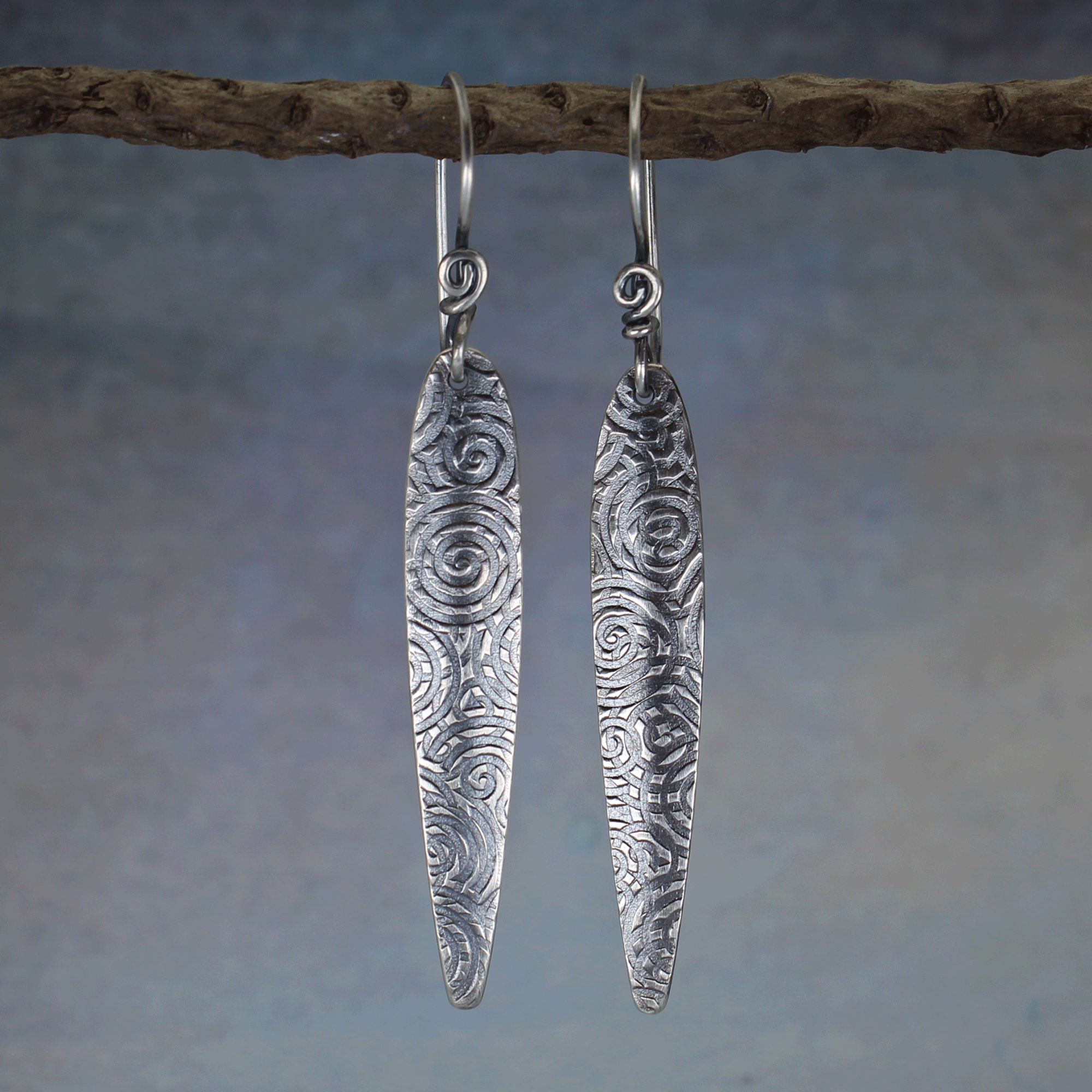 Spear shaped spiral pattern earrings handmade in sterling silver