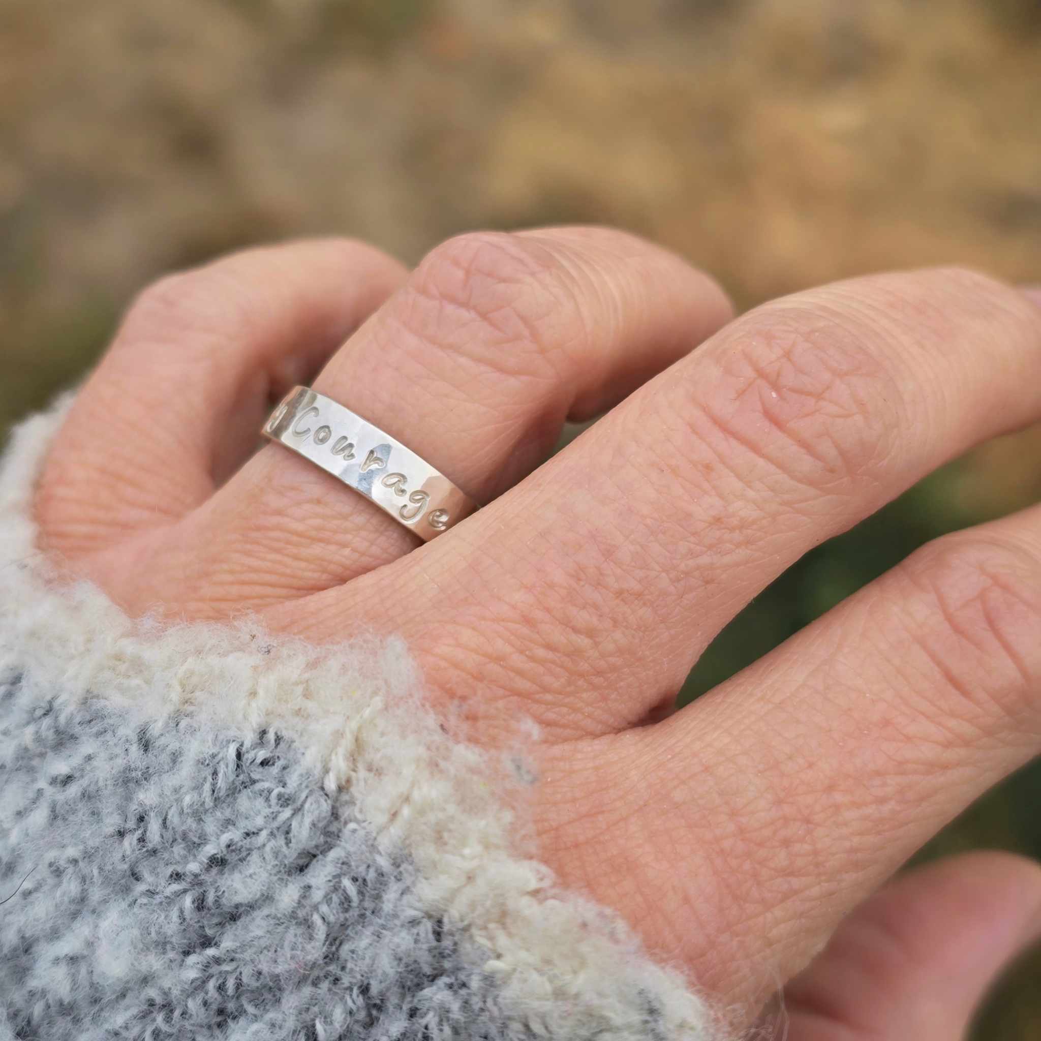 Serenity Courage Wisdom ring worn on hand, showing width and texture