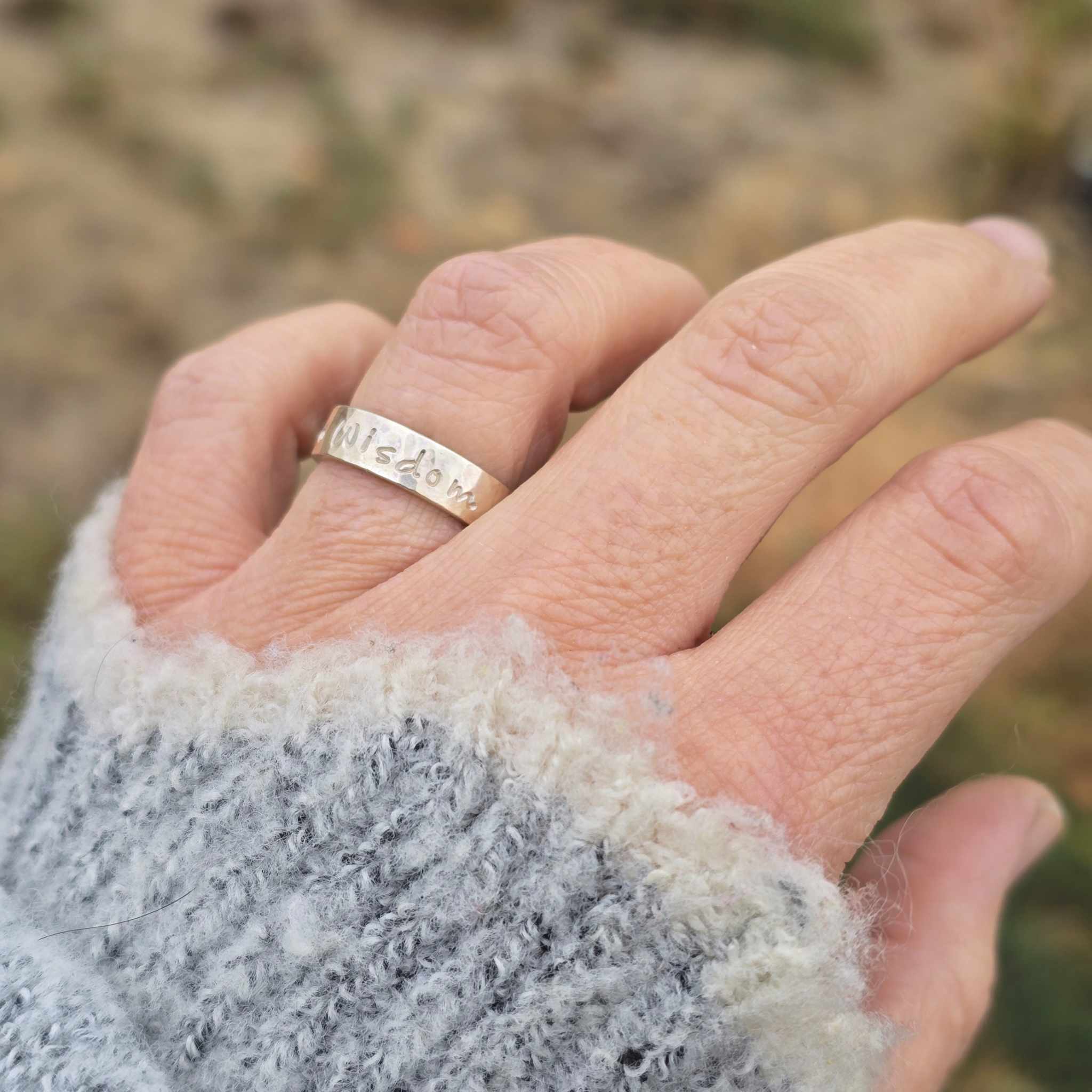 Lifestyle photo: Serenity Courage Wisdom ring styled on hand