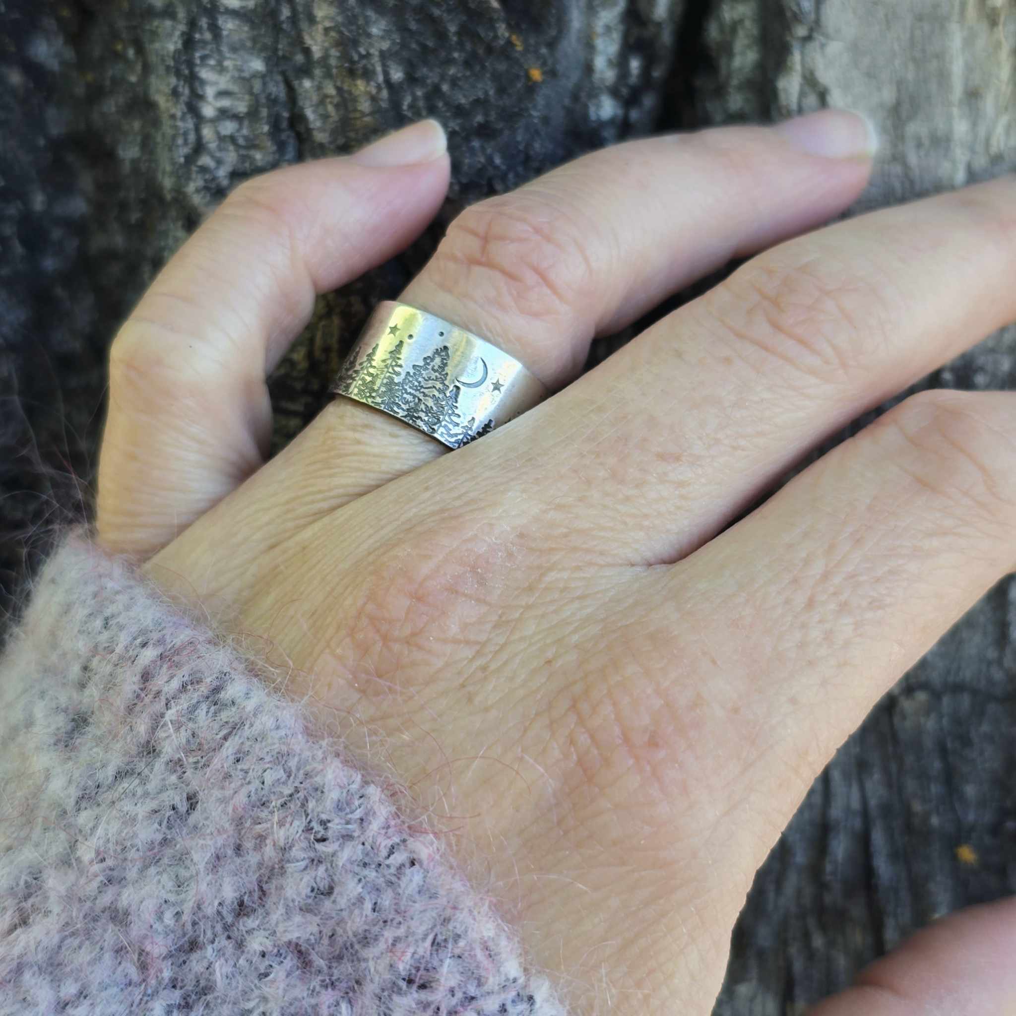Sterling silver tree ring on hand