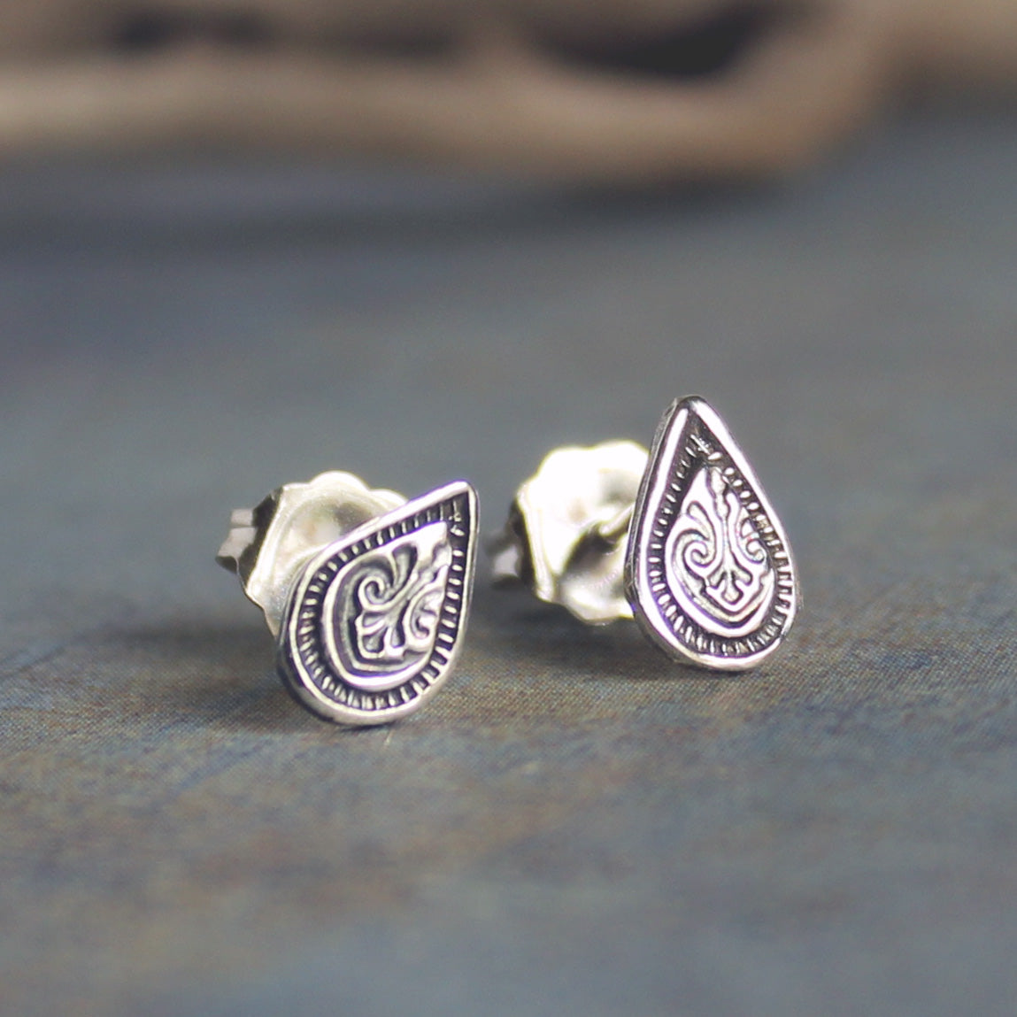 Handcrafted silver teardrop stud earrings with vintage style finish