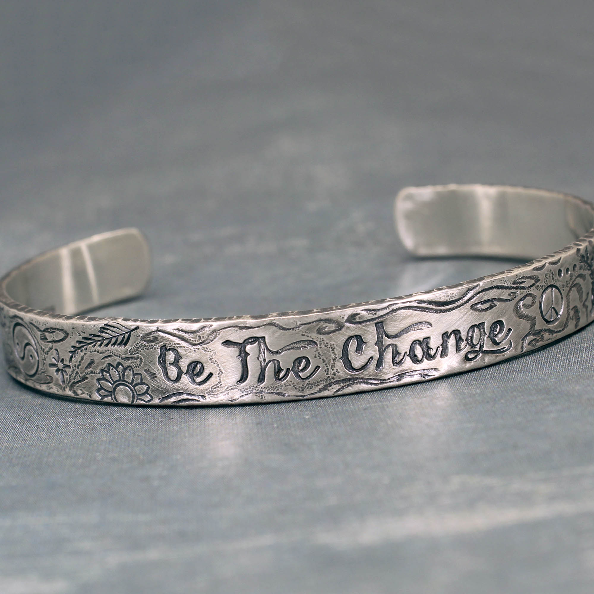 Be the Change sterling silver cuff bracelet with inspirational symbols