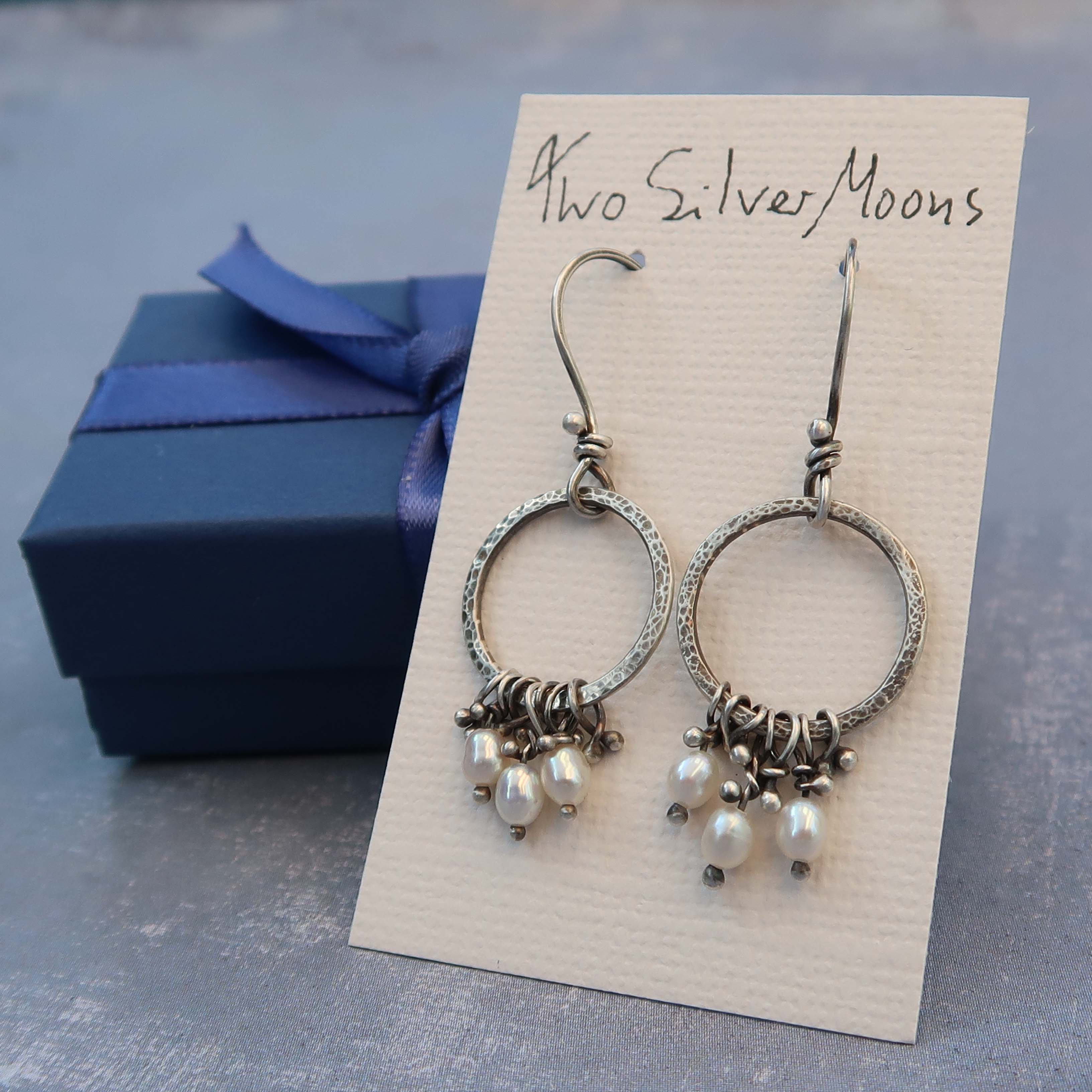 Pearl dangle hoops on example of packaging