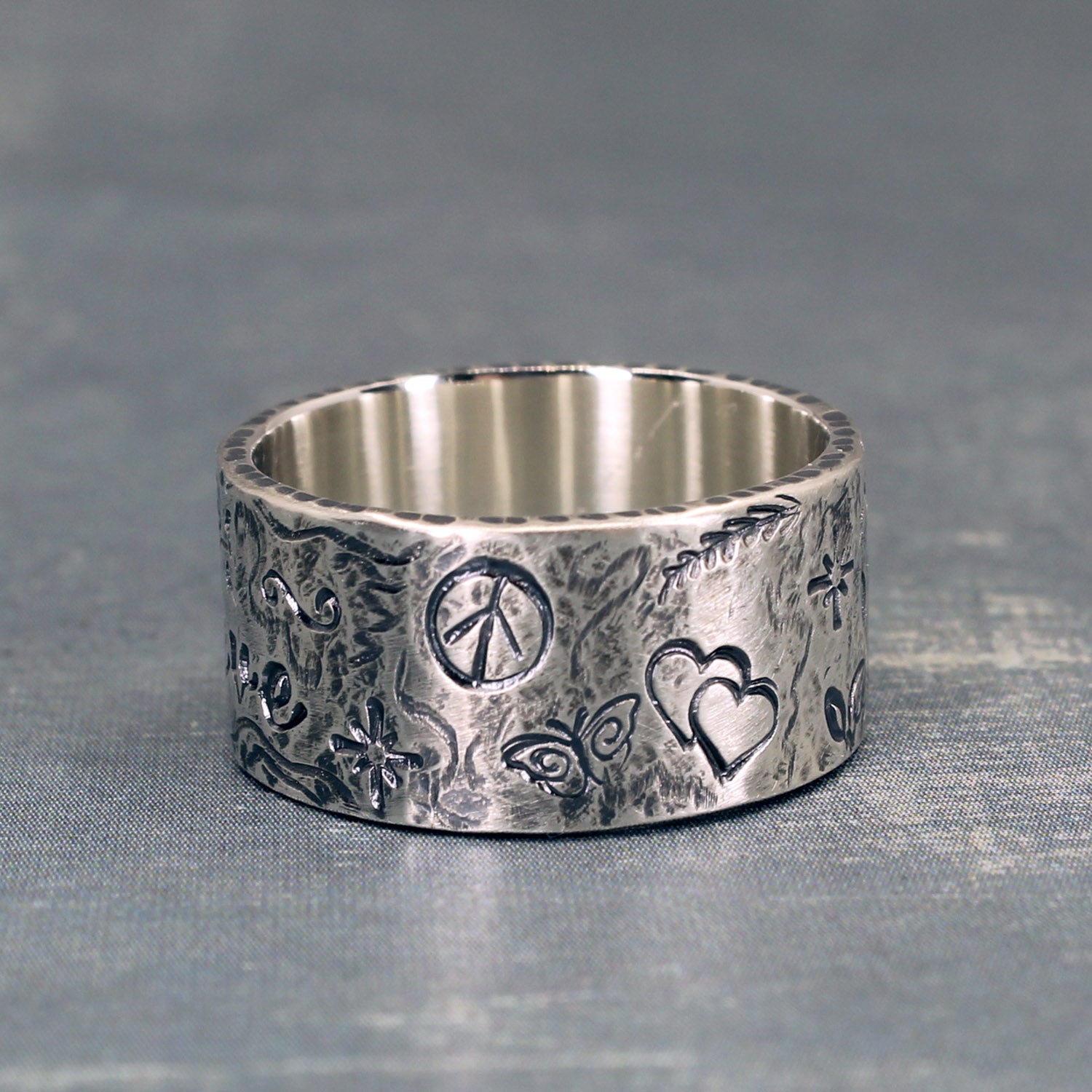 Believe ring from the back showing symbols