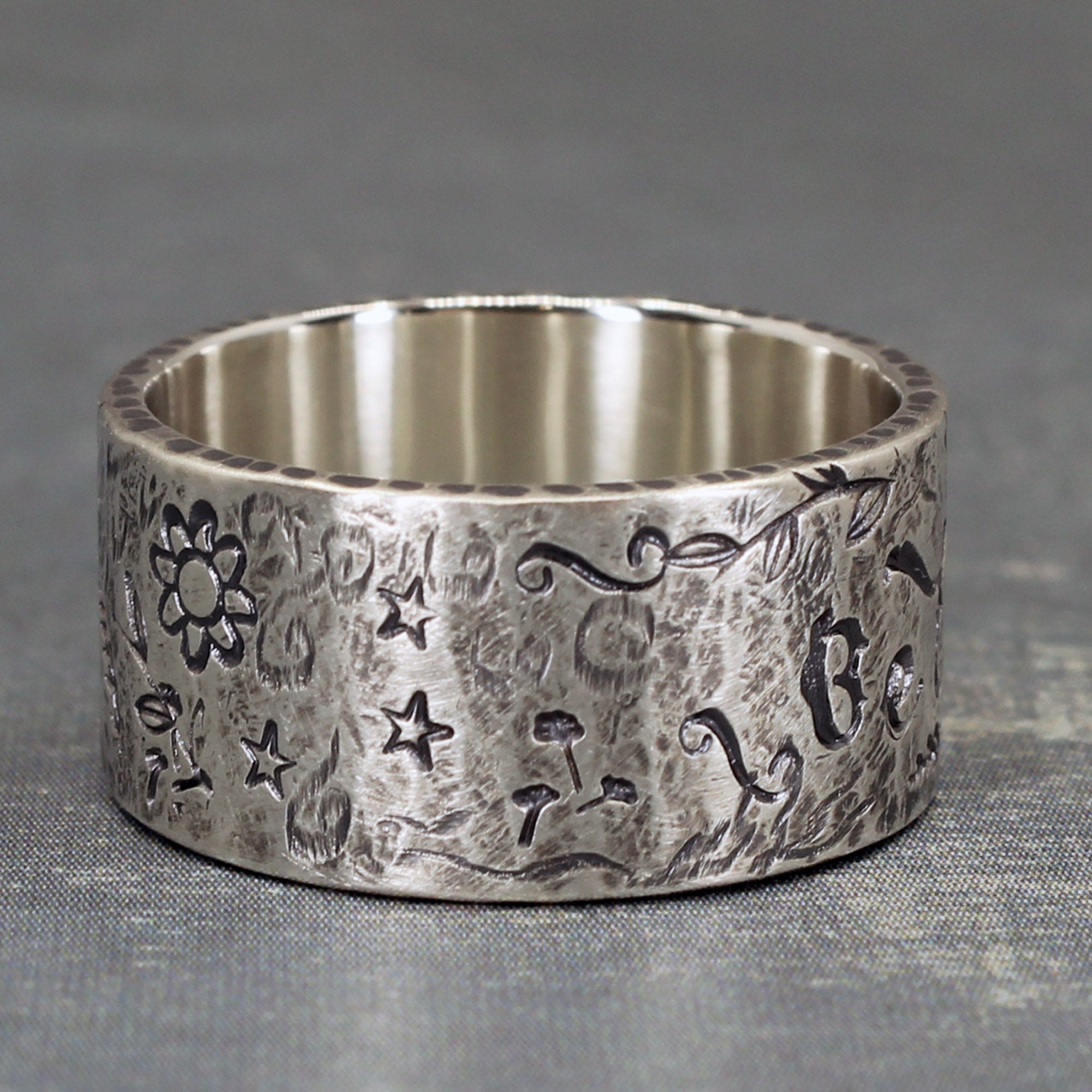 Believe ring from side to show symbols