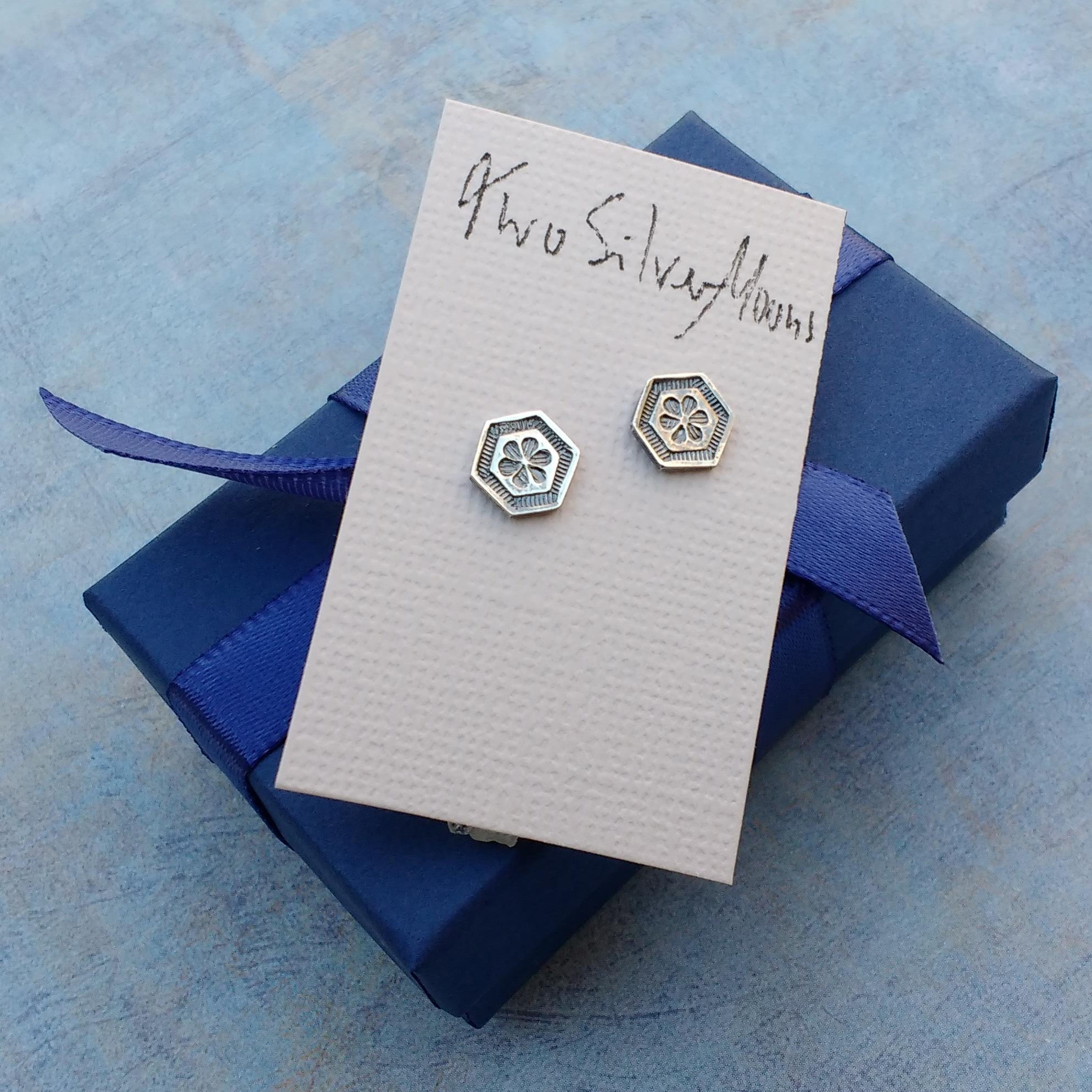 Floral studs with example of packaging