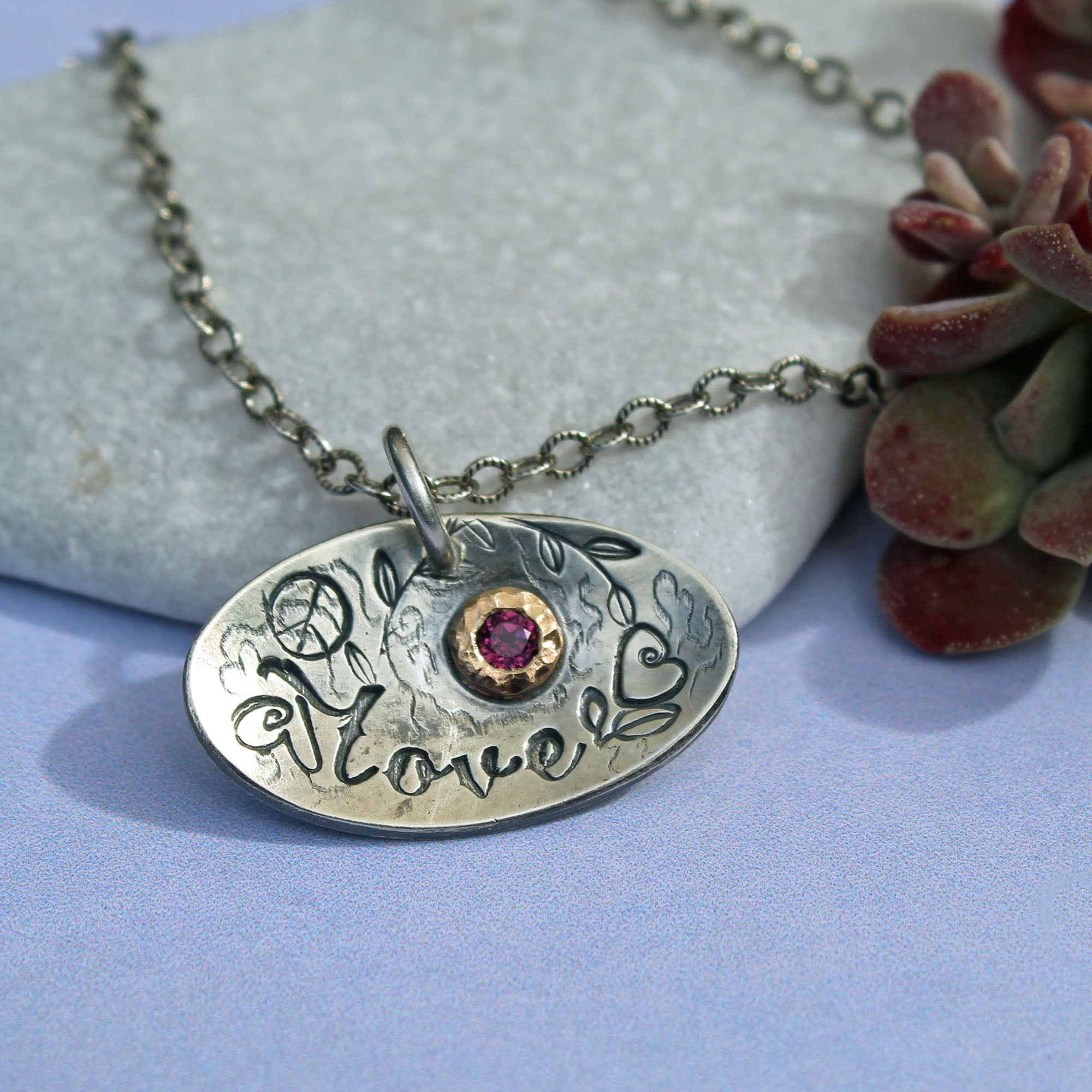 Love necklace with garnet gemstone