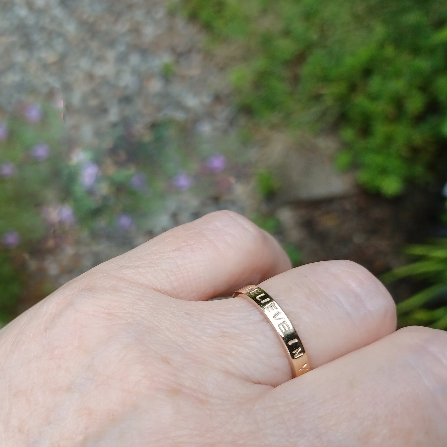 Gold ring shown on hand