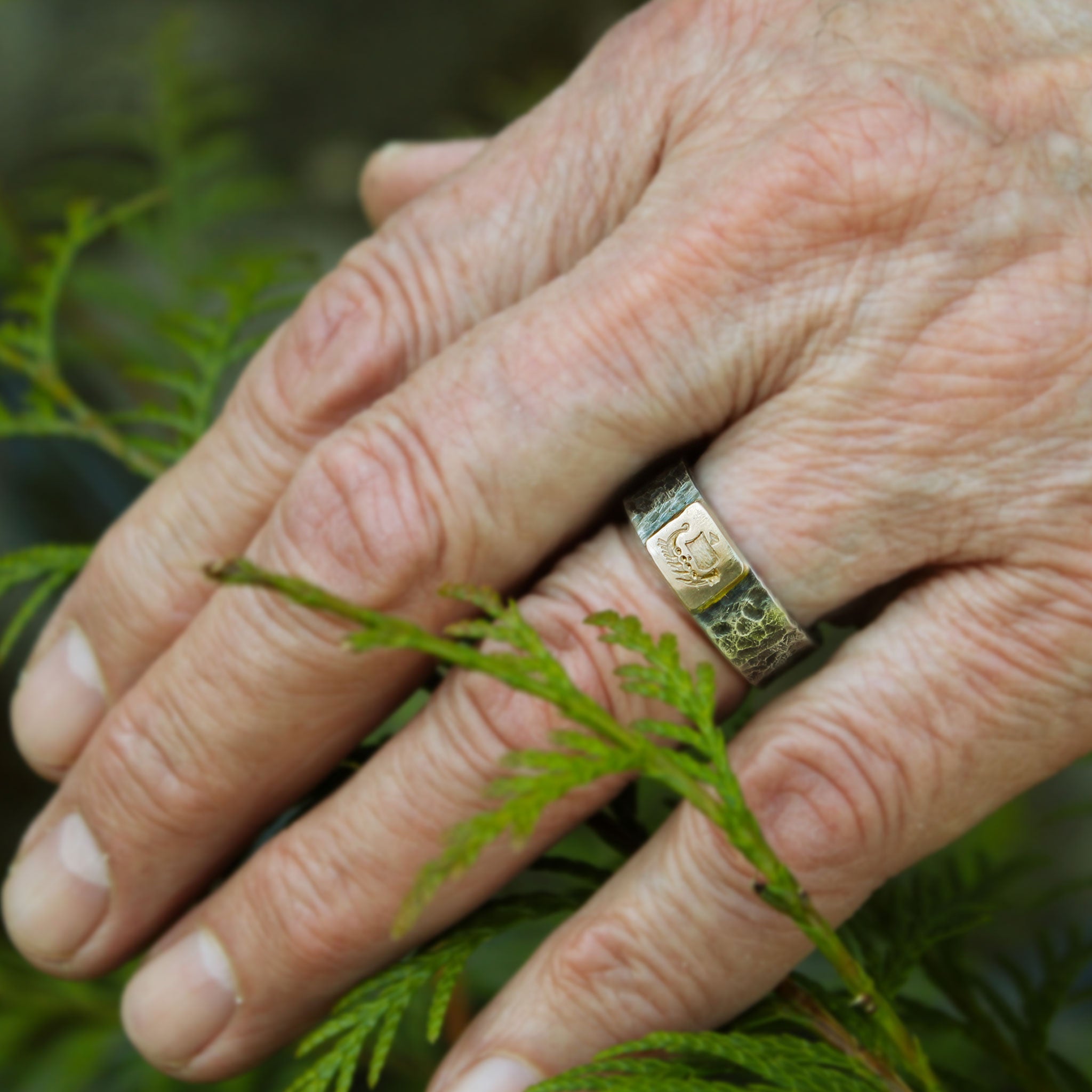 Viking ship ring shown on hand