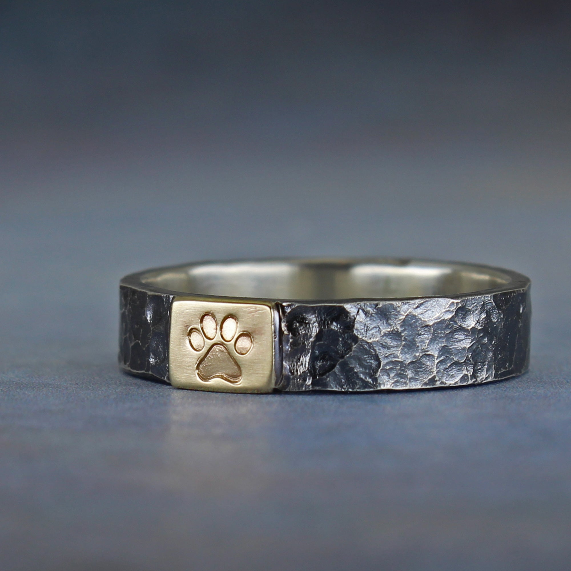 Handmade paw symbol ring in sterling silver and 10k gold