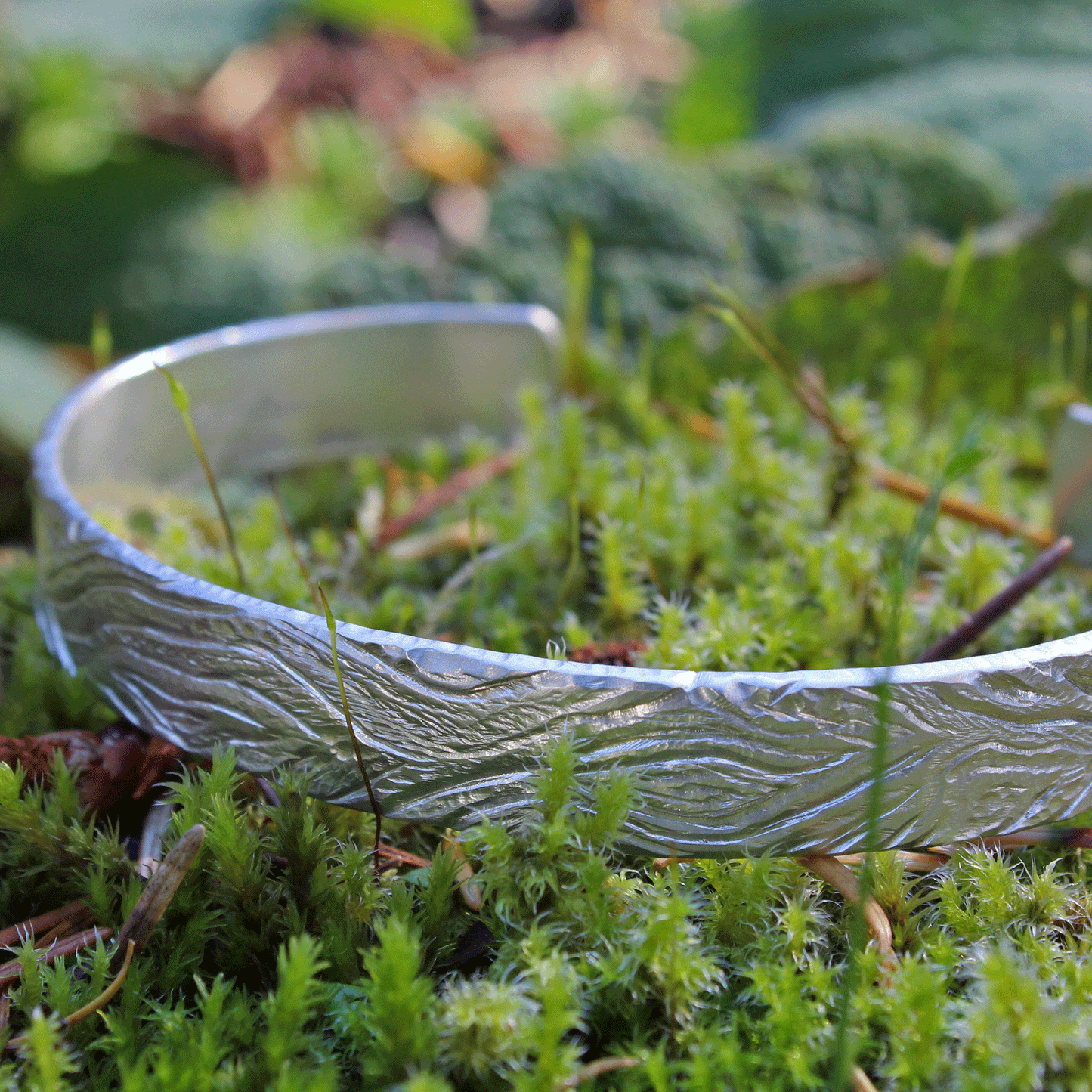 sterling silver cuff bracelet with a carved wood pattern