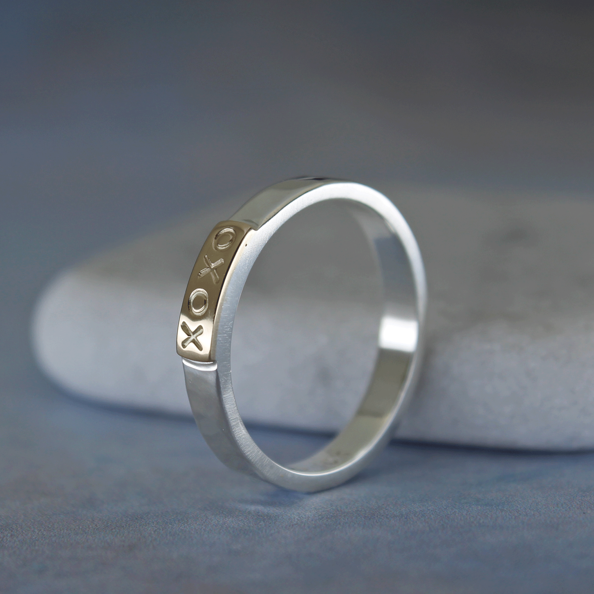 Side view of the sterling silver and 10k gold tab mixed metal ring.