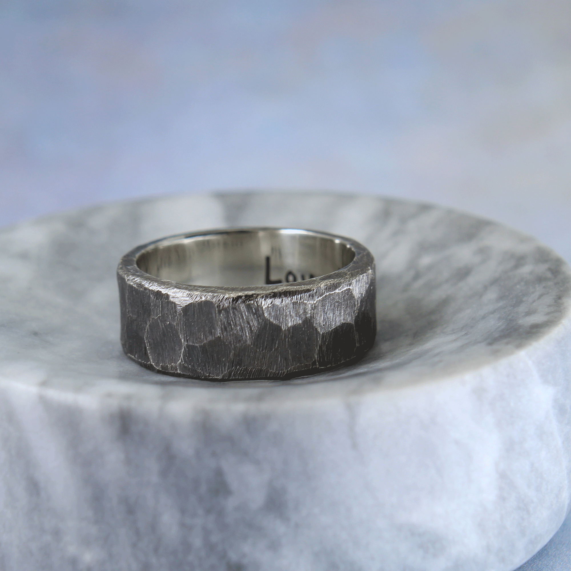Rough hewn sterling silver wedding band with custom inscription
