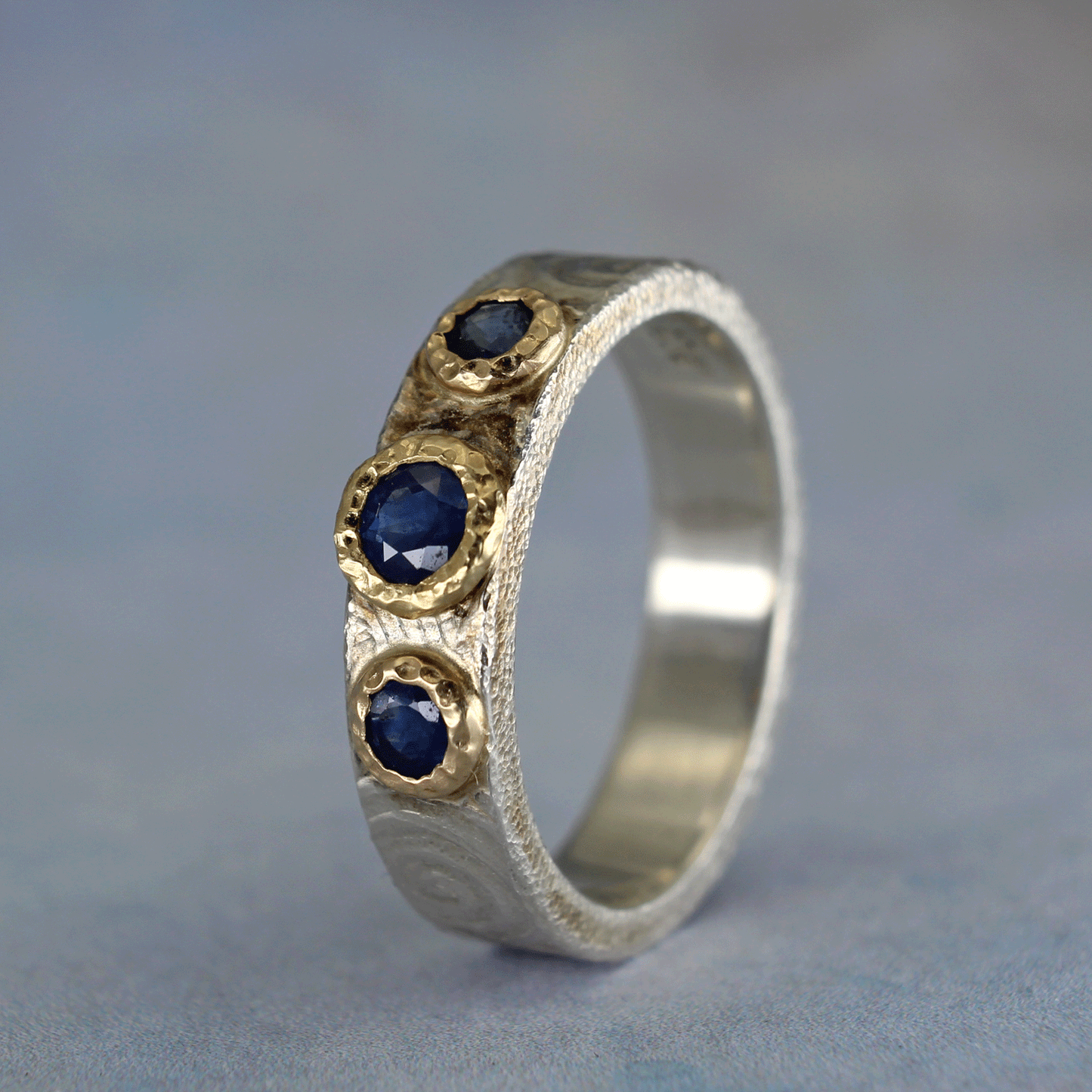 Spiral carved sapphire ring