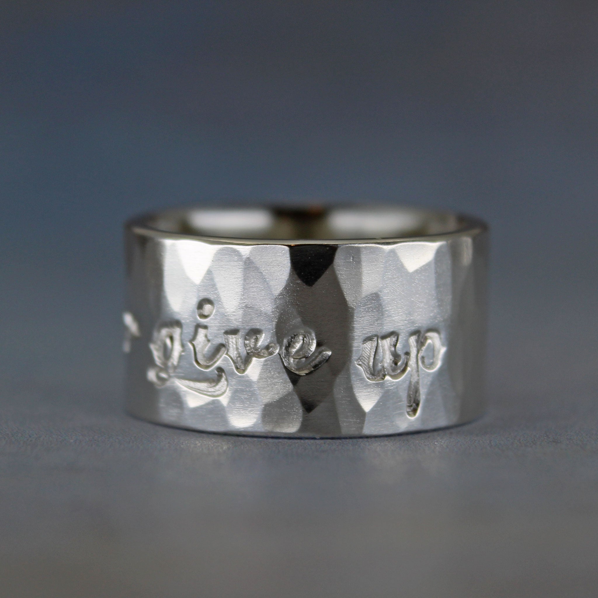 Never Give Up ring with hammered finish