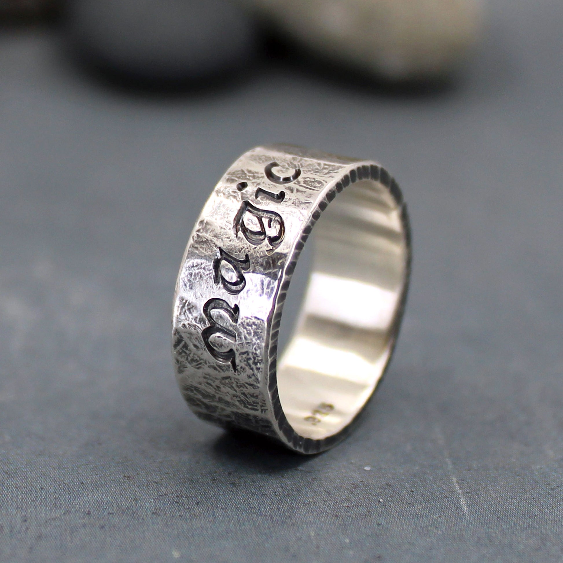 Magic inscribed on rustic silver ring
