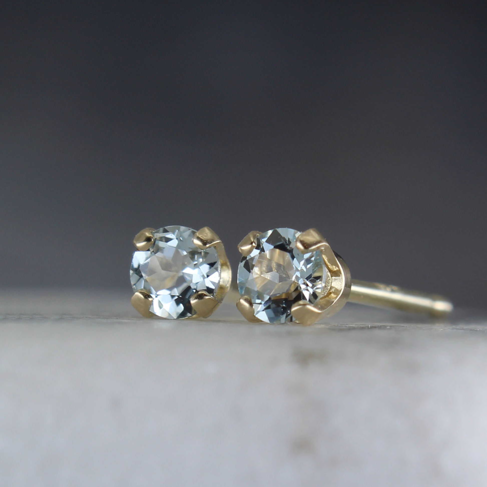 14k gemstone studs with sky blue topaz