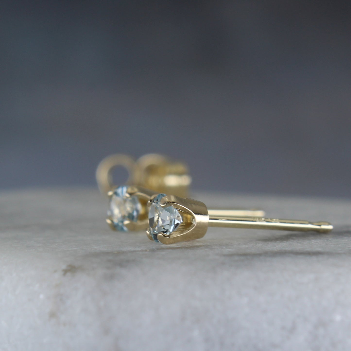 Blue topaz gemstone post earrings in 14k 