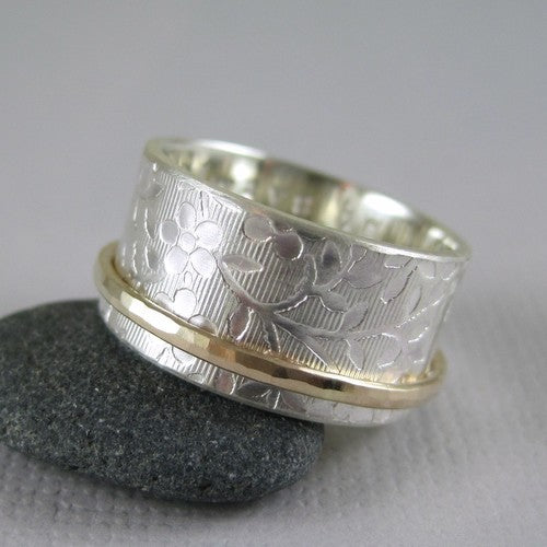 silver and gold spinner ring