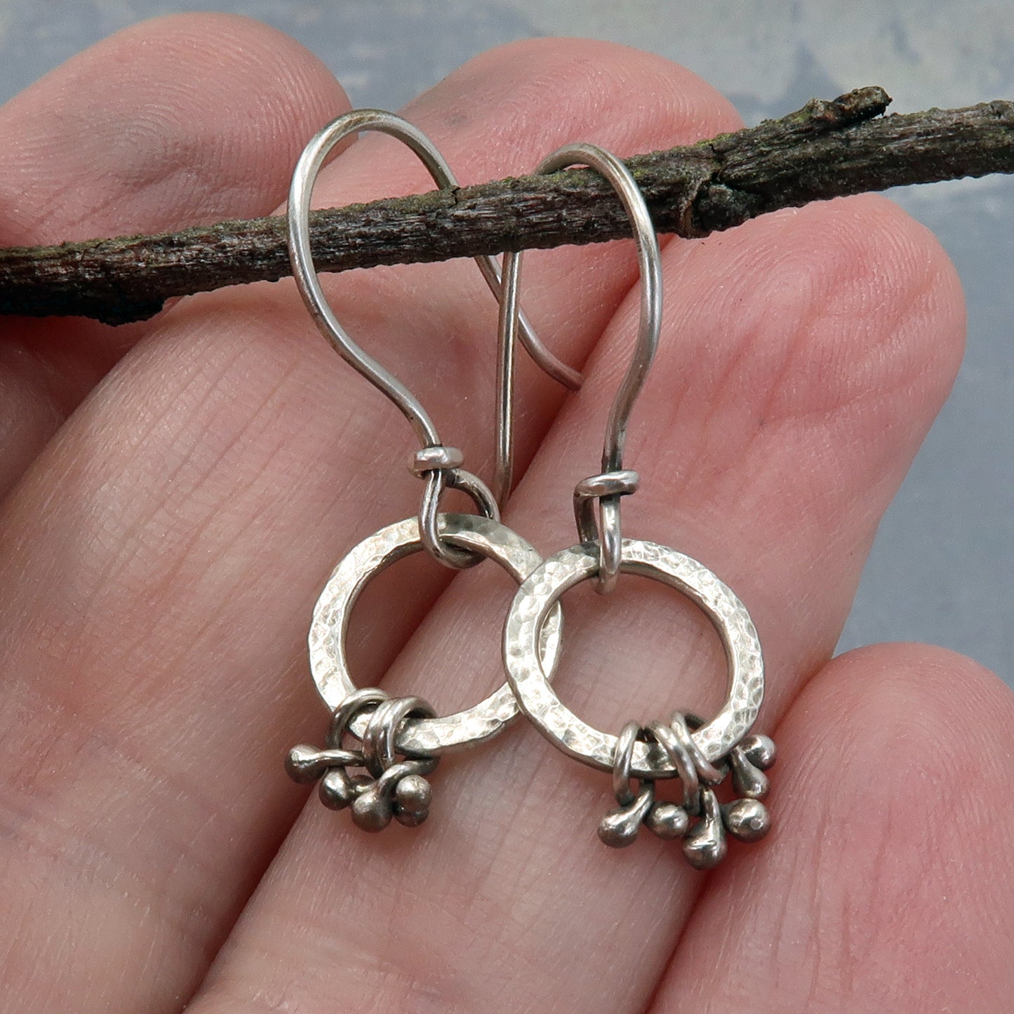 Tiny silver hoops with silver pebbles