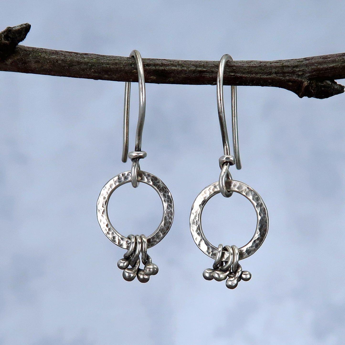 Tiny silver hoops with silver pebbles