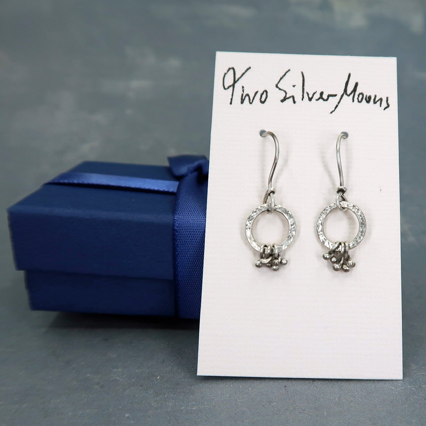 Tiny silver hoops with silver pebbles