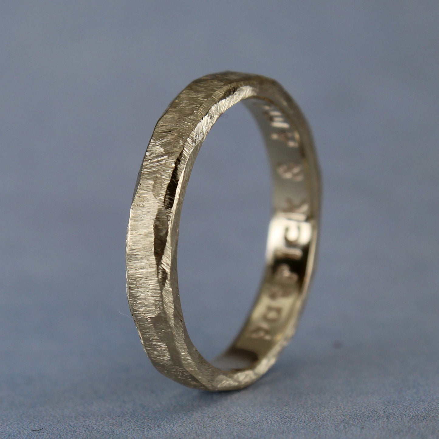 Gold ring with example of custom inscription on the inside. 